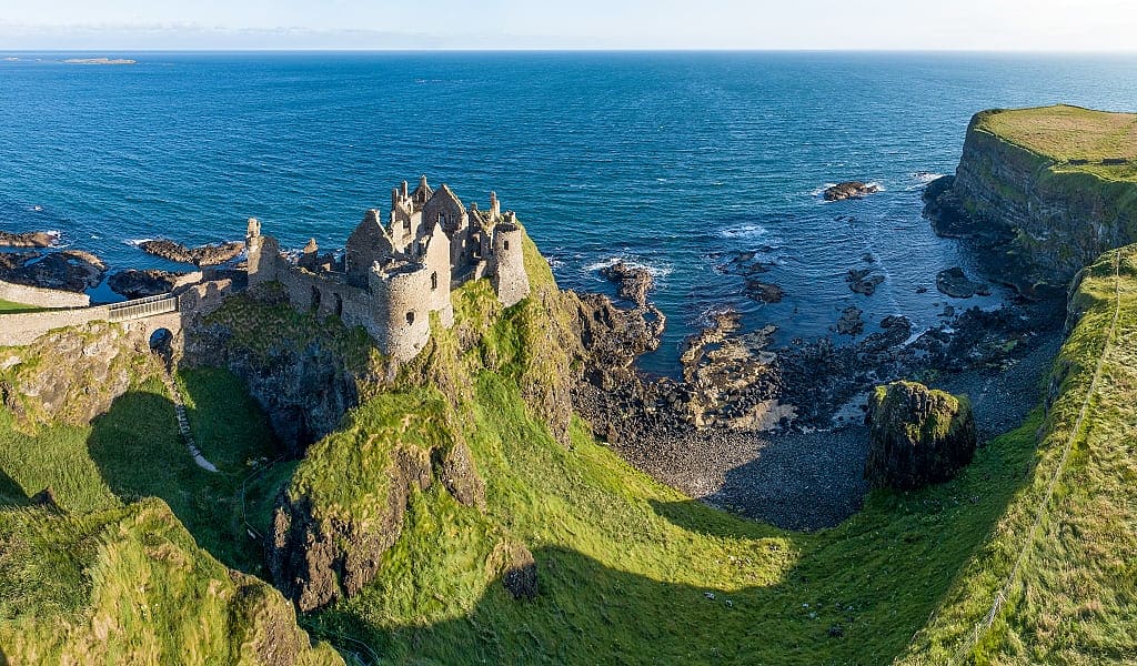 Ruins of medieval Dunluce castle on a steep cliff. northern coast of County Antrim, Northern Ireland