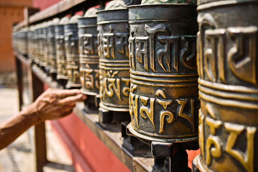 Spins prayers wheels in the Tibet, Nepal.