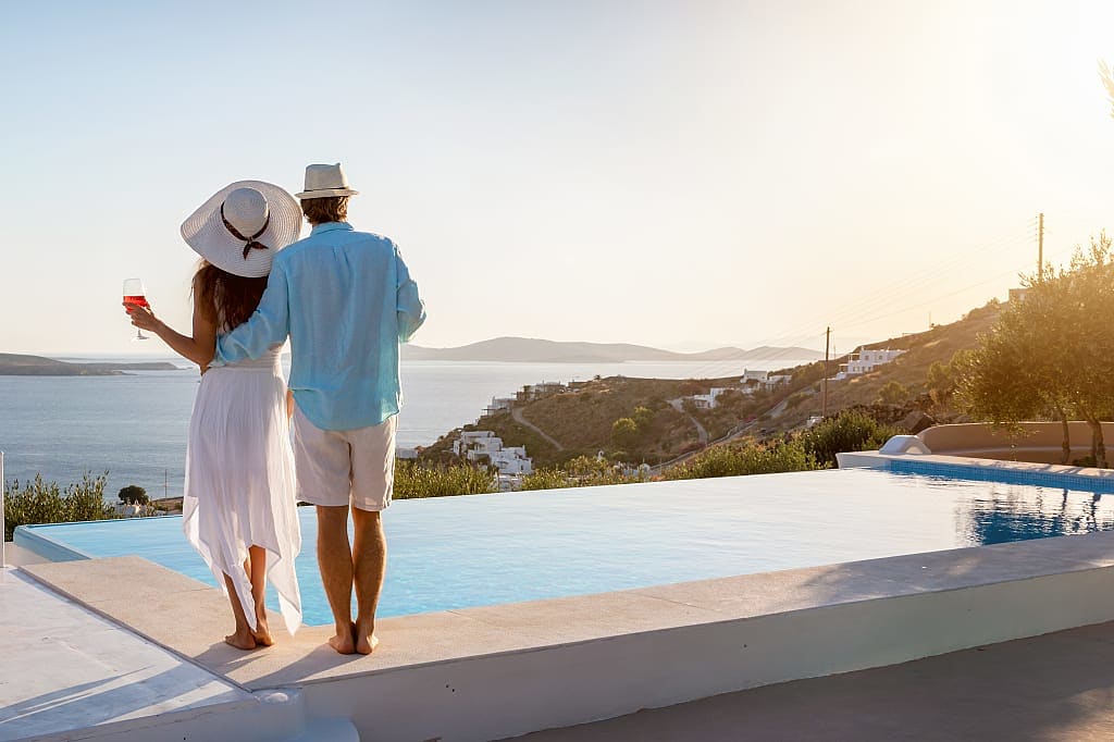 Couple by infinity pool in Greece