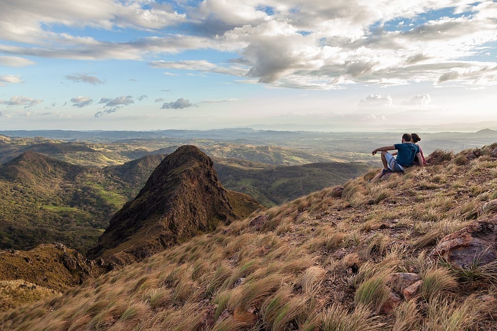Couple enjoying views of Guanacaste, Costa Rica from the top of Pelado Hill