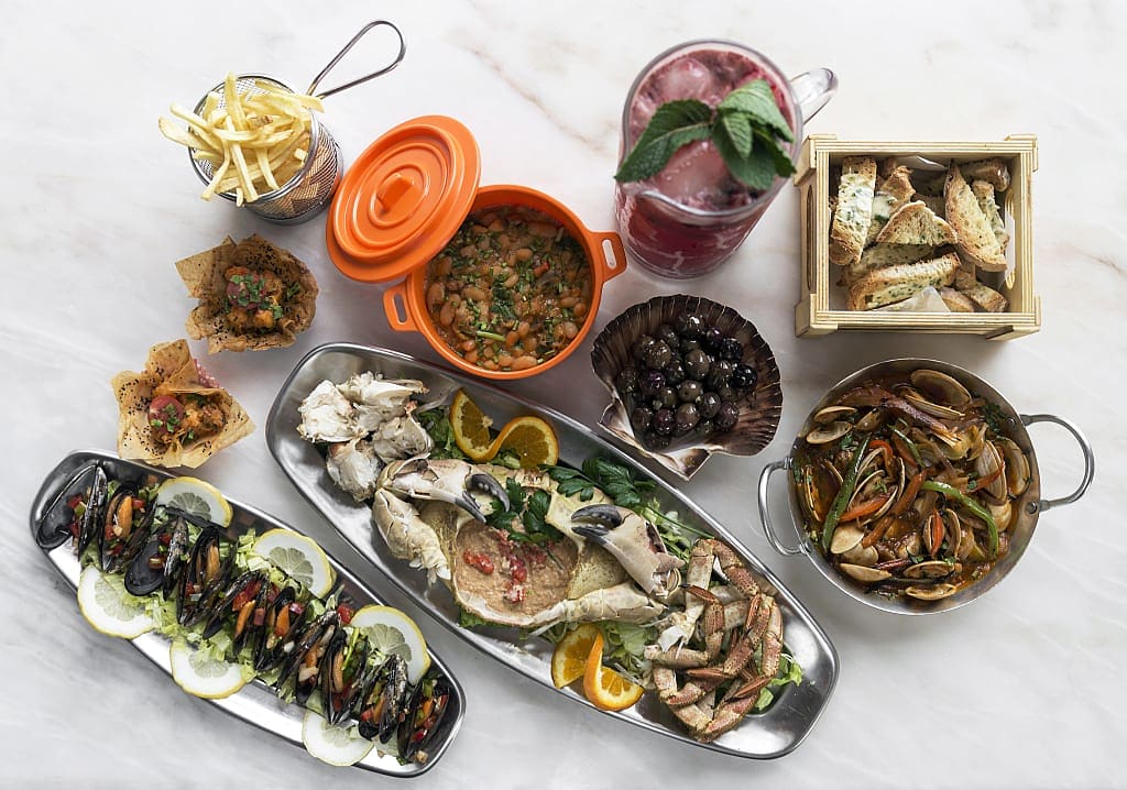 Mixed fresh Portuguese seafood selection at restaurant in Portugal