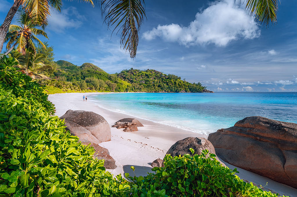 Couple on beautiful Anse Intendance beach on Mahe island, Seychelles