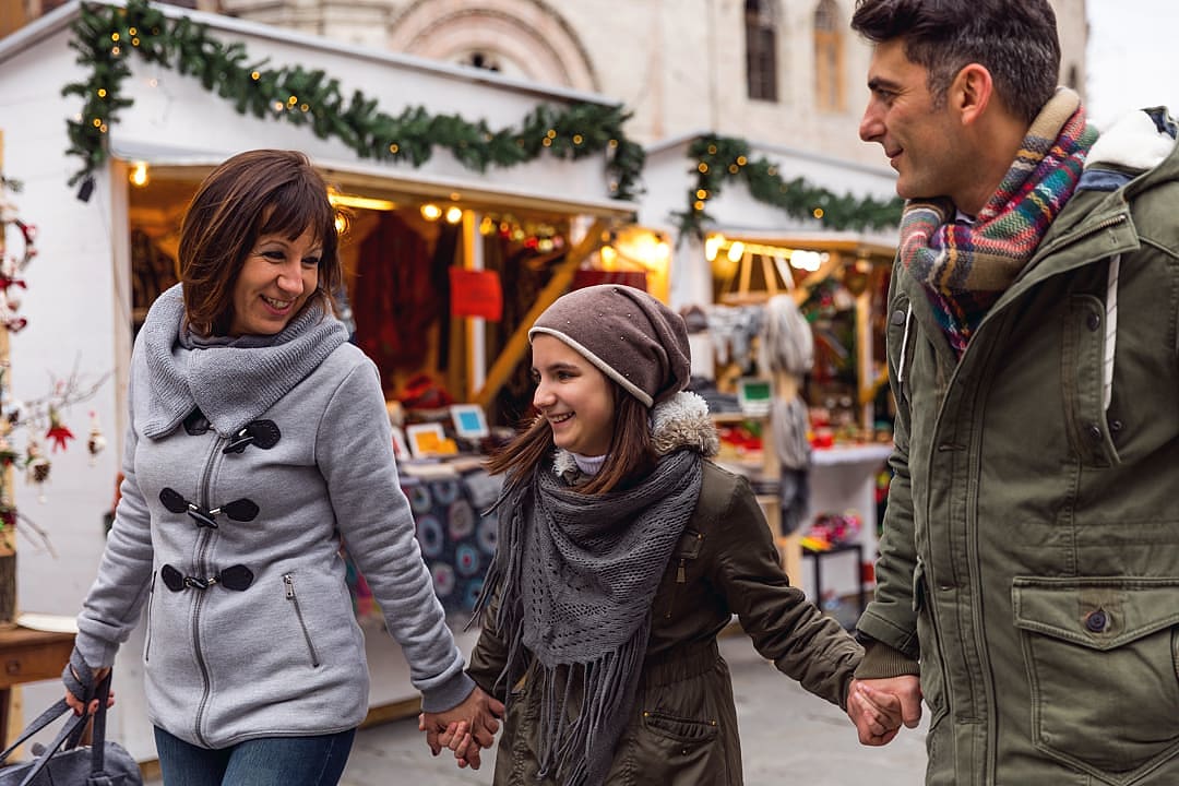 Family at a Christmas market in Italy