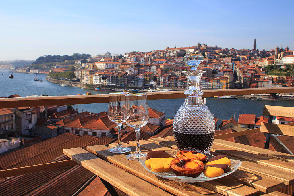 Pastéis de Nata, Portuguese egg tarts, and wine with a view of Porto