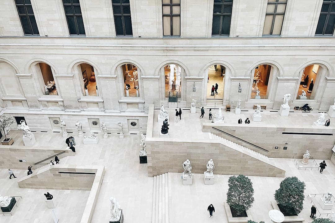 Tourists inside the The Louvre Museum in Paris
