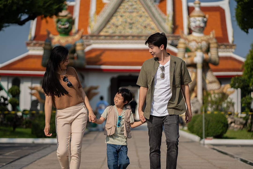 Family at the Grand Palace in Bangkok, Thailand.