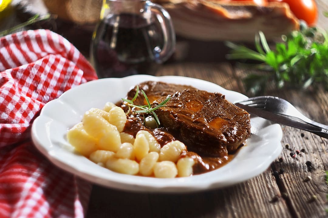 A Dalmatian dish of slow-cooked beef in a rich red wine and prune sauce, traditionally served with homemade gnocchi