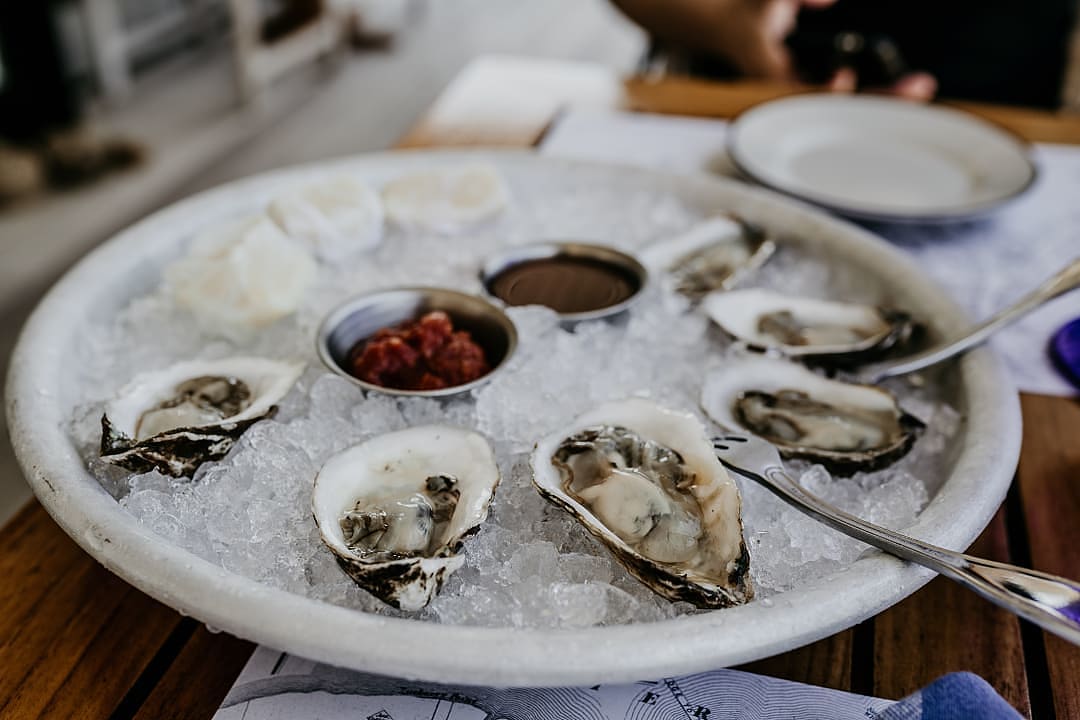 Fresh oysters served on plate, France.