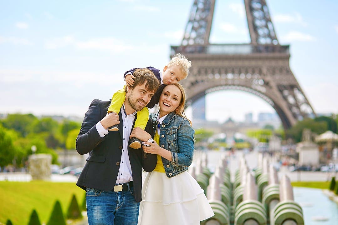 Family at the Eiffel Tower in Paris, France