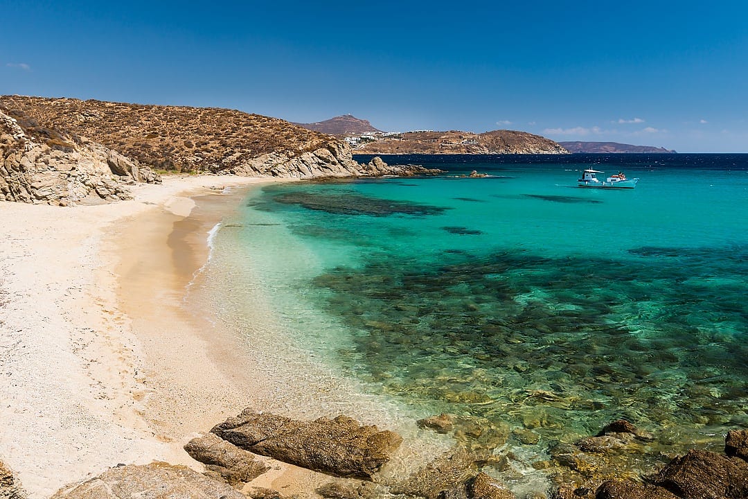 Turquoise water, golden sand, rocky hills, peaceful and untouched beauty.