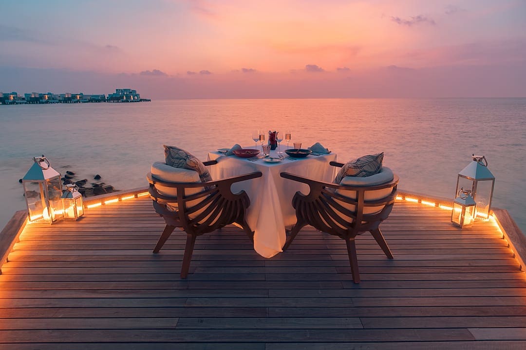 Romantic dinner at sunset in Kudadoo in the Maldives