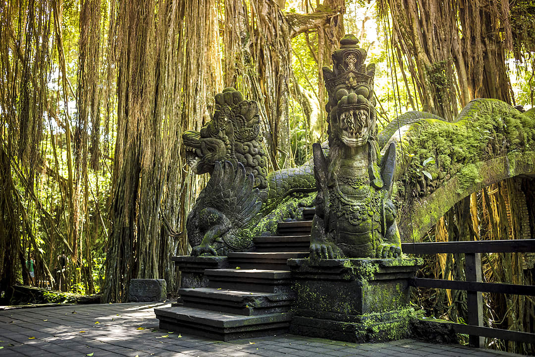 Dragon sculptures on bridge in Ubud Monkey Forest, Bali.