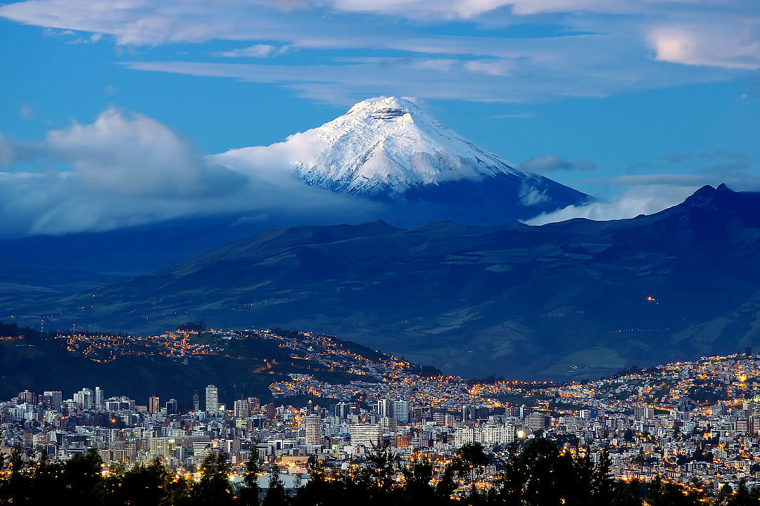 Quito city with Cotopaxi volcano in the background in Ecuador