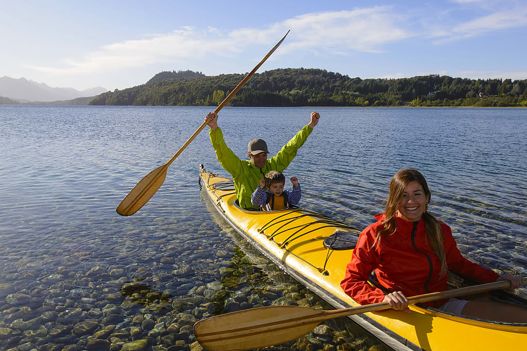 Family kayaking Nahuel Huapi Lake in Bariloche, Argentina