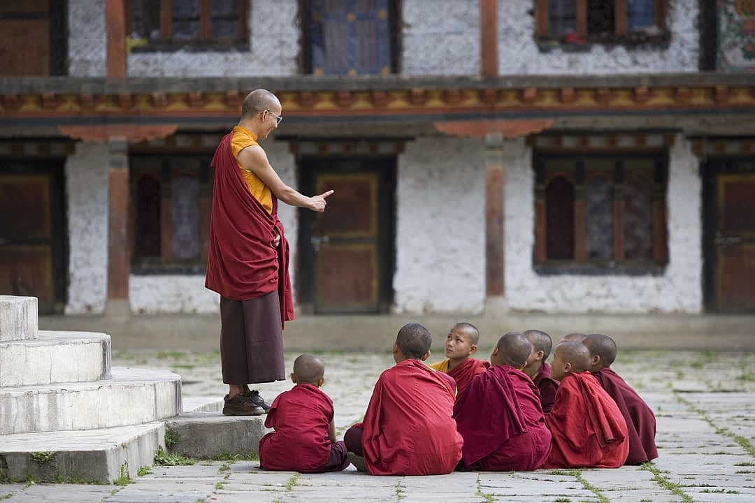 Buddhist monks at The Karchu Dratsang Monastery in Paro Valley, Bhutan.