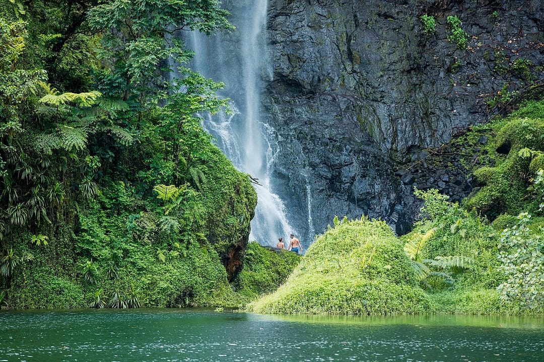 Couple at a waterfall in Tahiti, French Polynesia