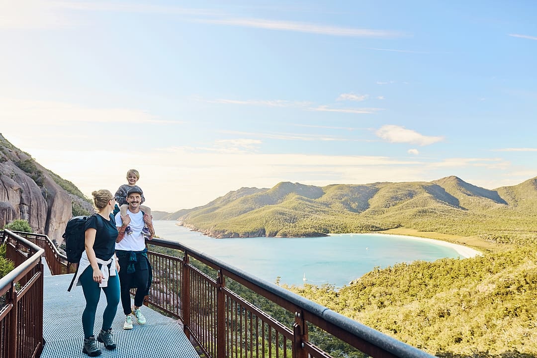 A family enjoying the beautiful natural landscapes of Freycinet National Park.