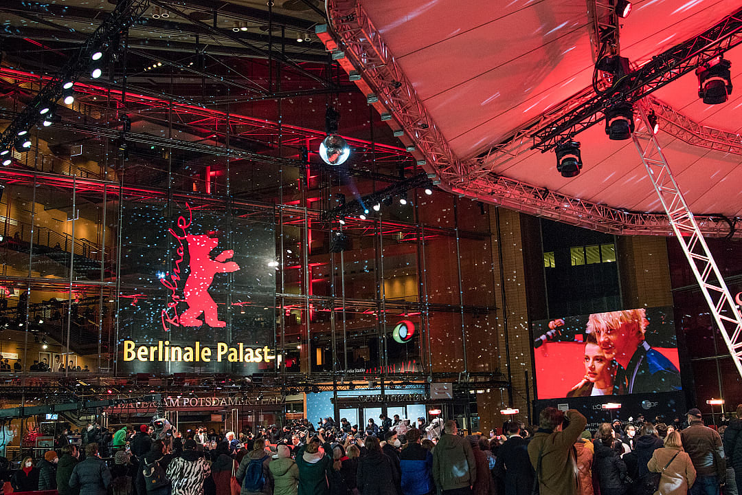 Red carpet event at Berlinale Palast during the Berlin International Film Festival, with a lively crowd