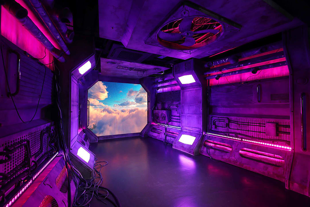 Immersive K-Pop cultural studio with neon lights and digital displays in Seoul, South Korea.