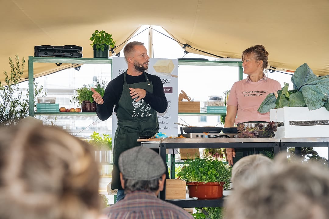 Chef giving a cooking demonstration with fresh produce at Copenhagen Cooking and Food Festival
