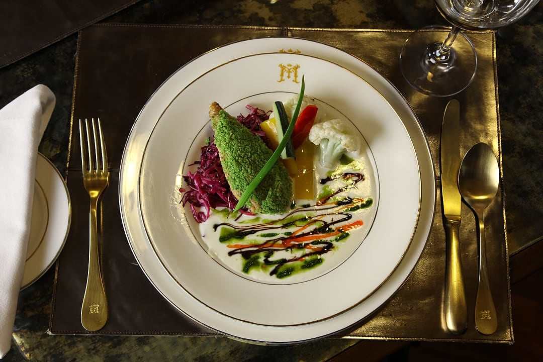 Elegant gourmet dish served aboard India’s luxurious Maharajas’ Express train.