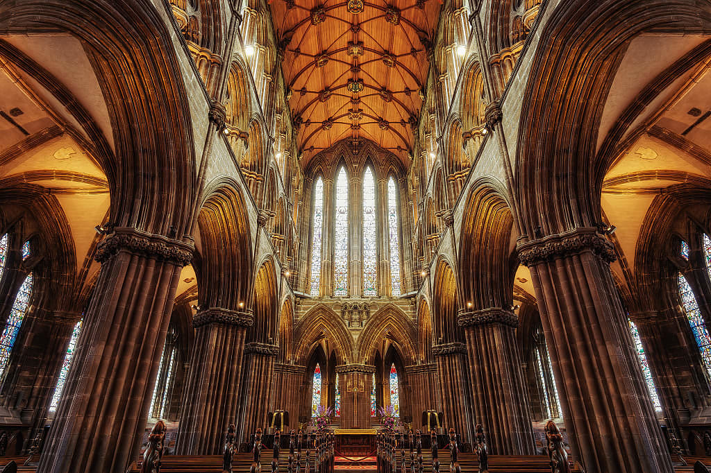 Gothic interior of Glasgow Cathedral with stained glass windows