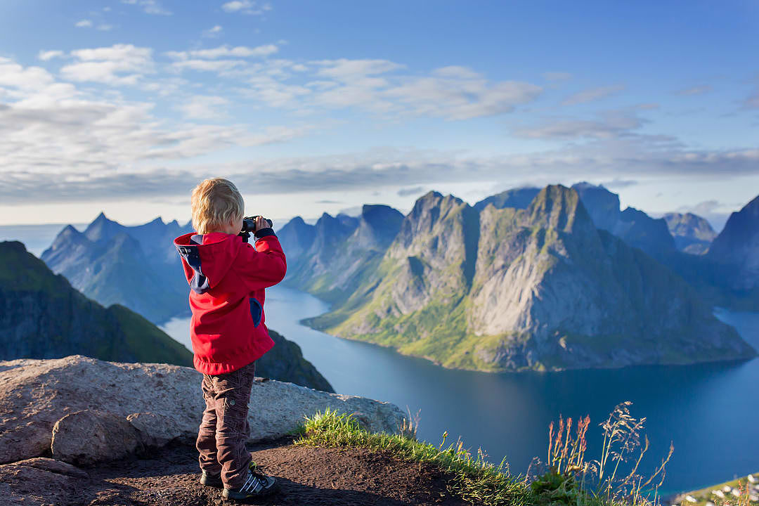 Kid enjoying nature and view in Lofoten, Norway