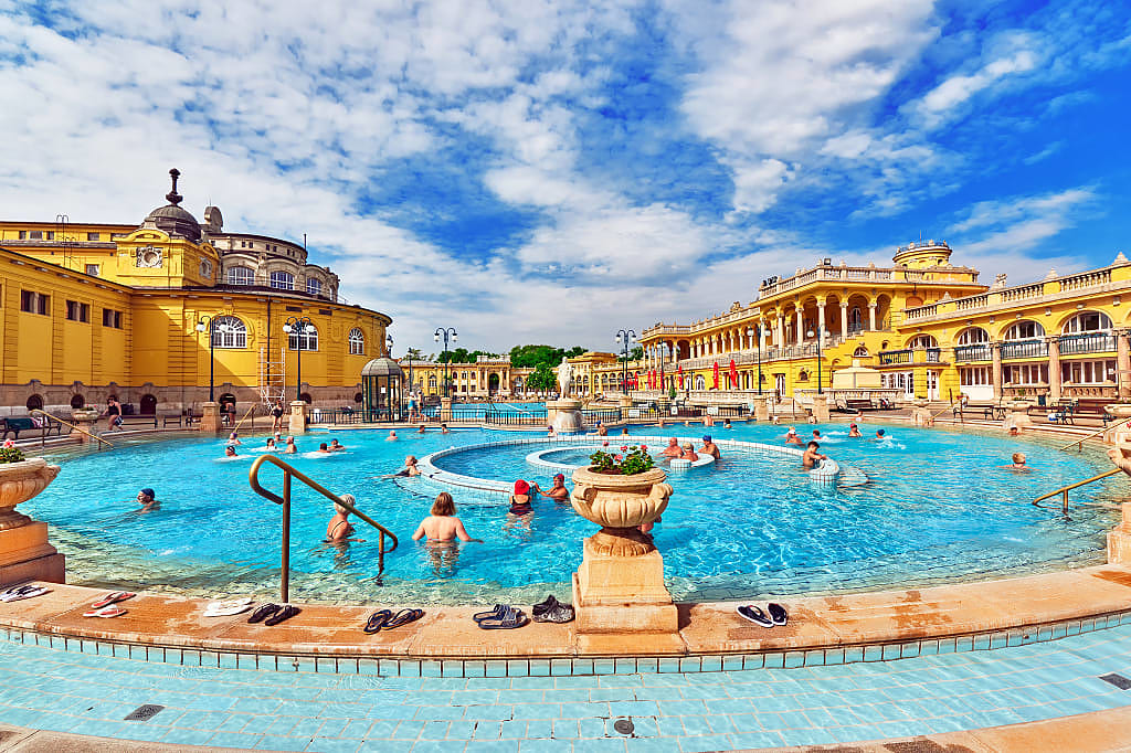 People enjoying thermal baths in the courtyard of Szechenyi Baths