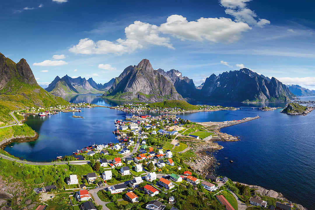The village of Reine under a sunny blue sky in Lofoten, Norway