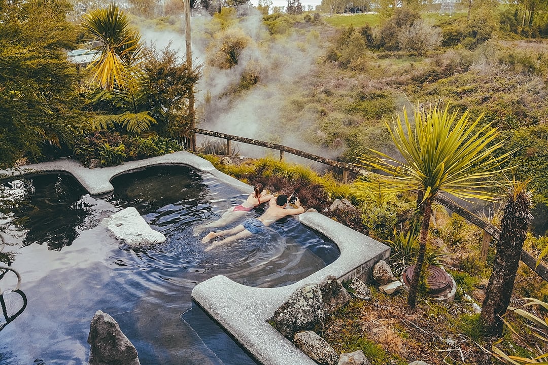 Couple at thermal hot springs in New Zealand