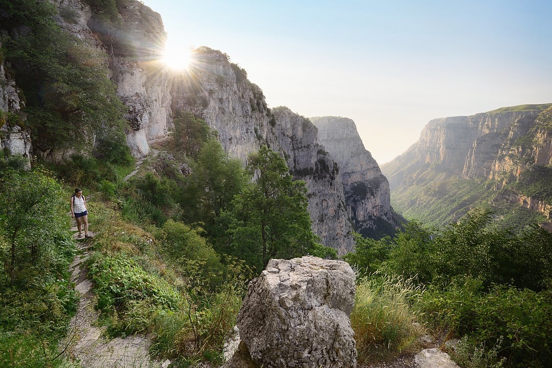 Woman hiking Vikos Gorge in Zagori, Greece