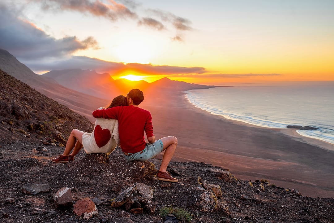 Couple watching the sunset in the Canary Islands, Spain