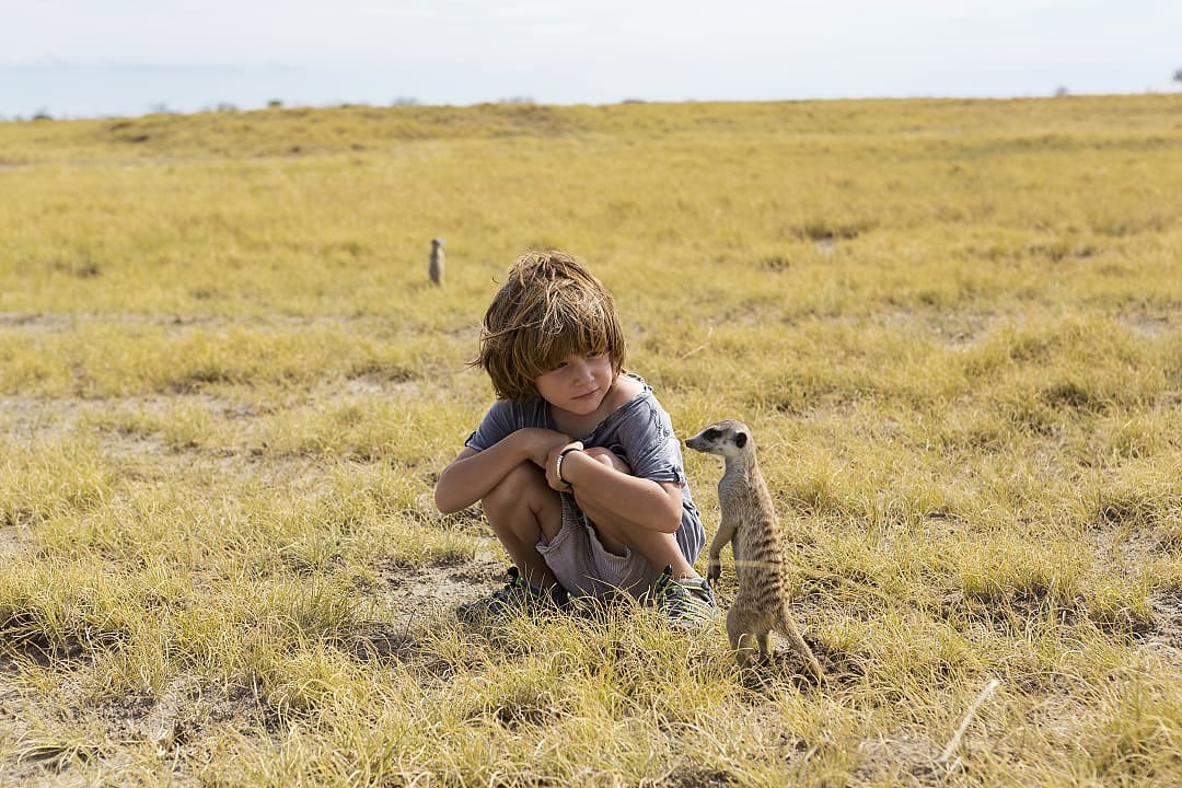 Boy exploring the African savannah in Botswana.