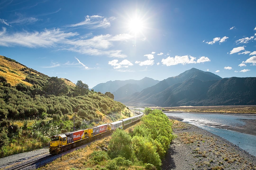 TranzAlpine train along the Waimakariri River in New Zealand