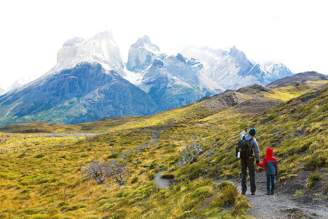 Family hiking in Torres del Paine National Park in Chile