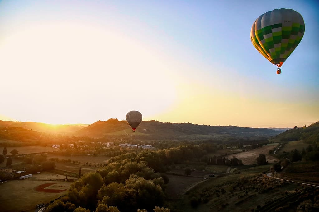 Hot air balloons and landscape in Tuscany, Italy