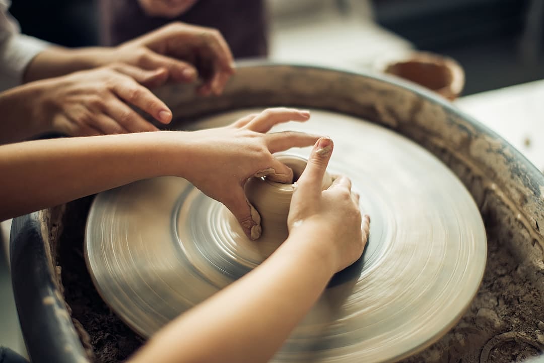 Young child at a pottery workshop