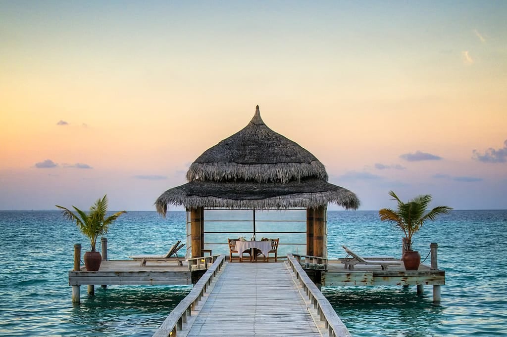 Romantic seaside dining at sunset in the Maldives