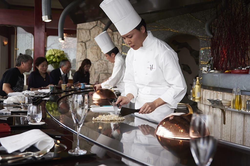 Chef preparing food at restaurant in Tokyo, Japan