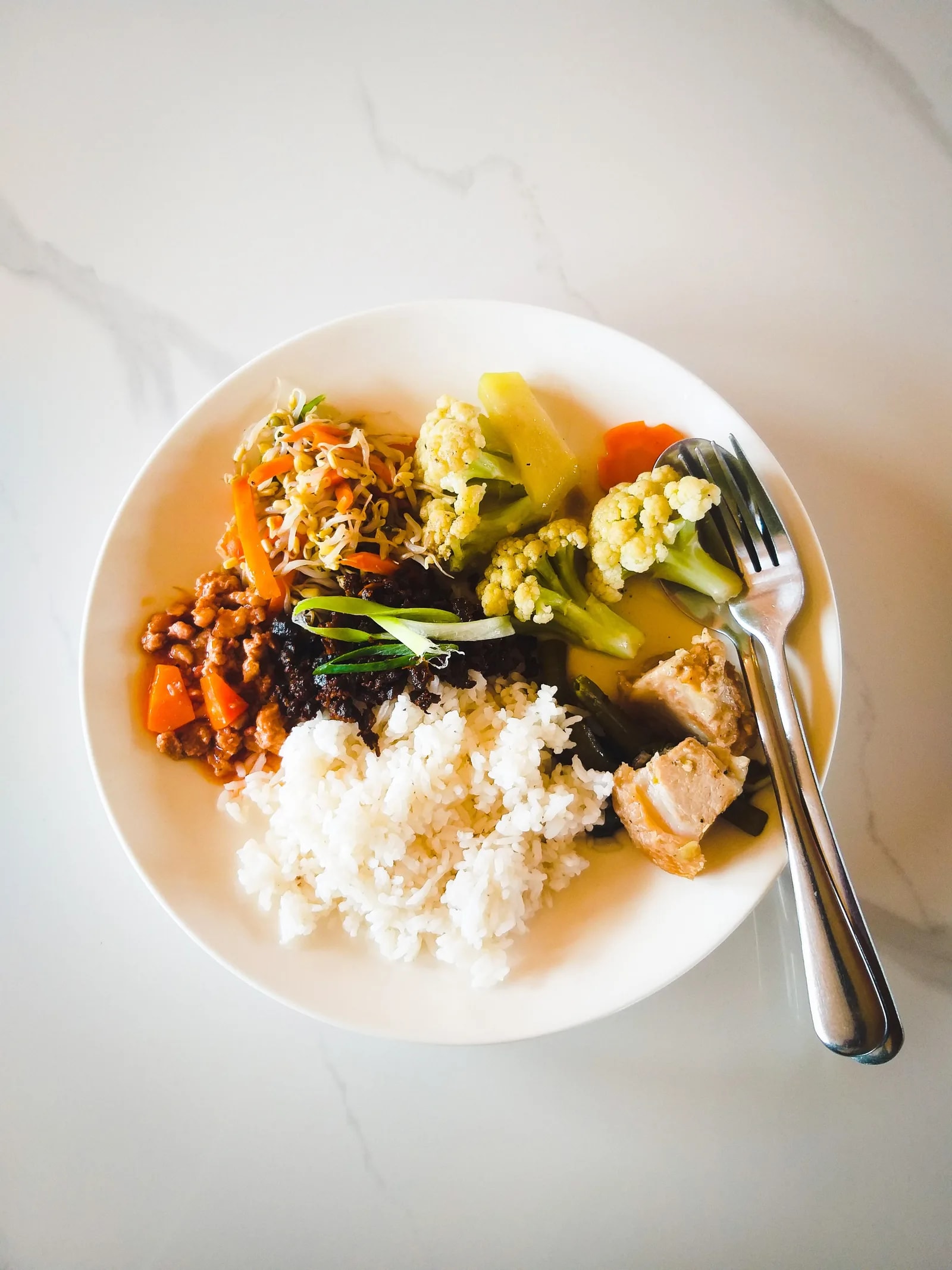 Balanced rice, vegetables, and protein served together on a plate