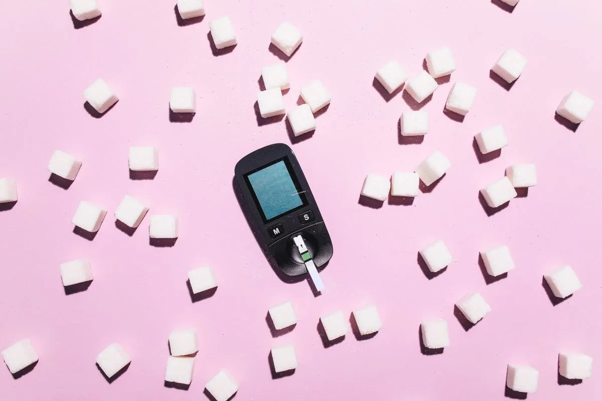 Sugar cubes arranged around a blood glucose meter