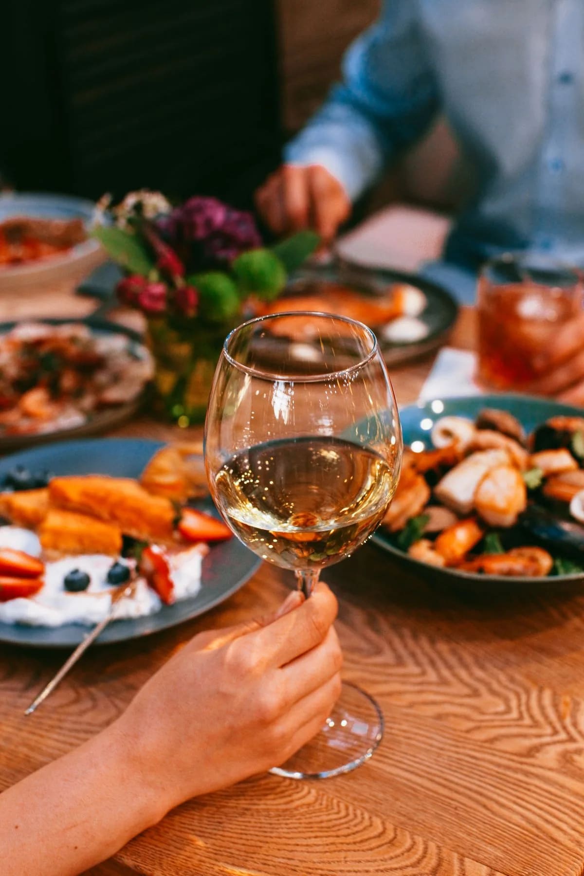 People dining with wine at a restaurant