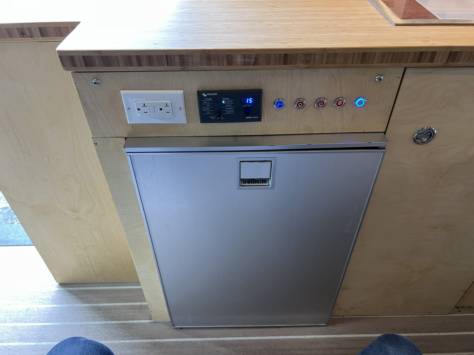 A tiny fridge inside the van