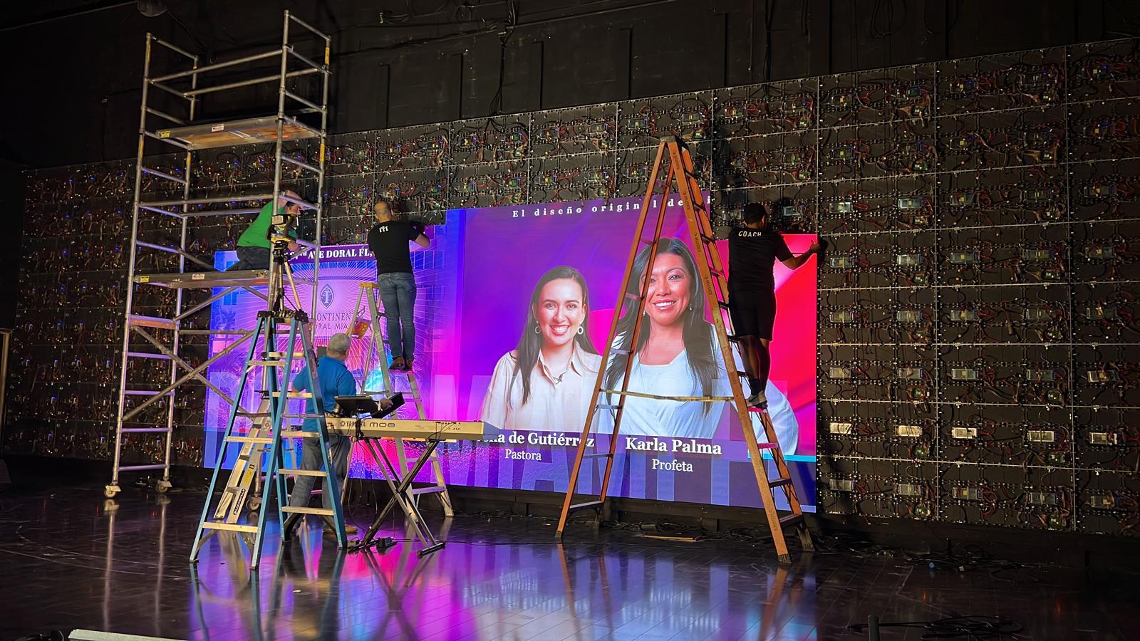 Technicians installing LED panels