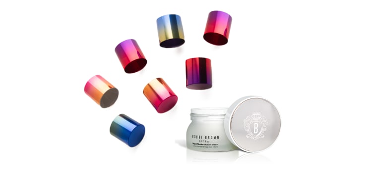 Metallized gradient caps beside a laser-engraved Bobbi Brown jar lid