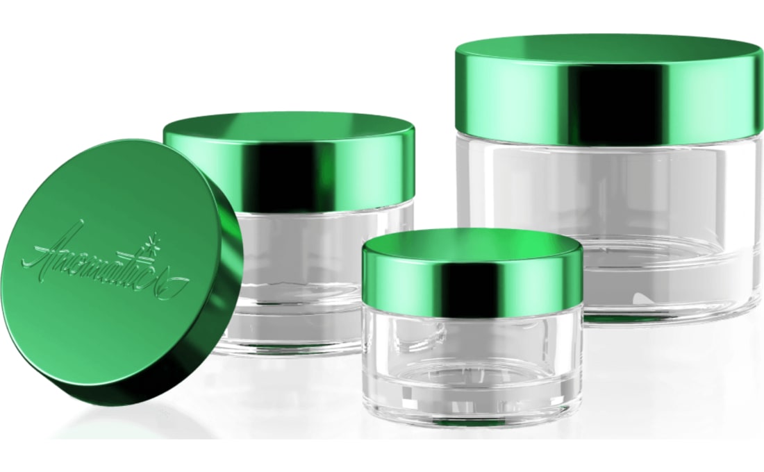 evercycle jars with green anodized aluminum lids, one lid set beside them
