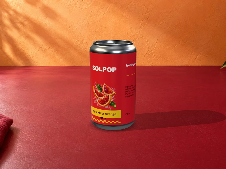 Tangerine and raspberry SOLPOP cans on a raspberry counter with an apricot wall
