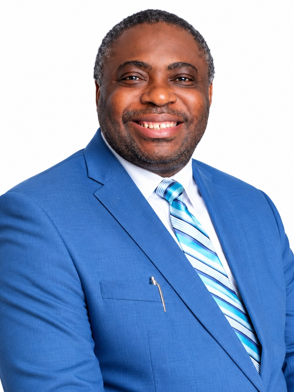 Portrait of Dr. Kingsley I. Onwuzurigbo, founder of Kingswill Specialist Hospital, formal professional attire, dignified expression