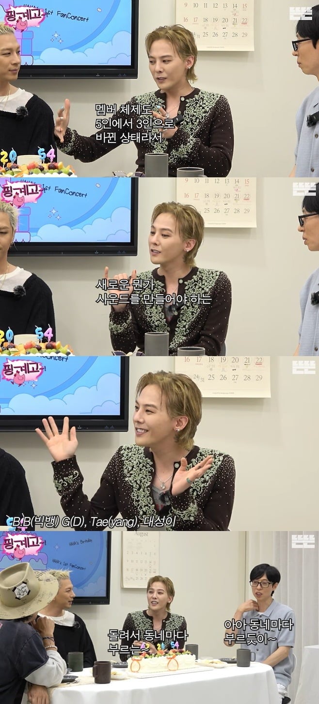 G-Dragon Pinggyego programındaki çekimler sırasında konuşurken
