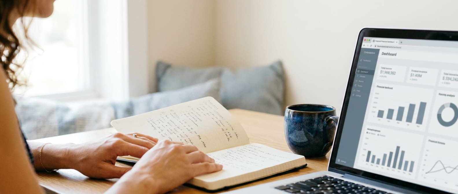 Reviewing a financial dashboard alongside handwritten notes